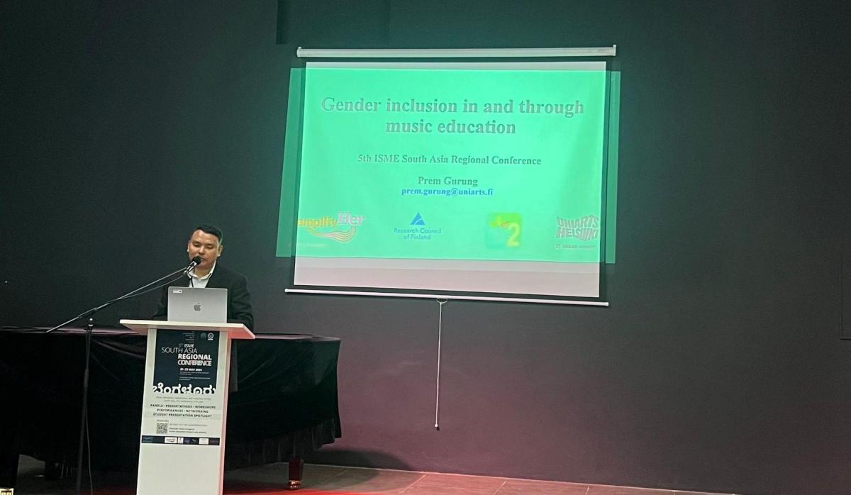 Prem Gurung presents the paper