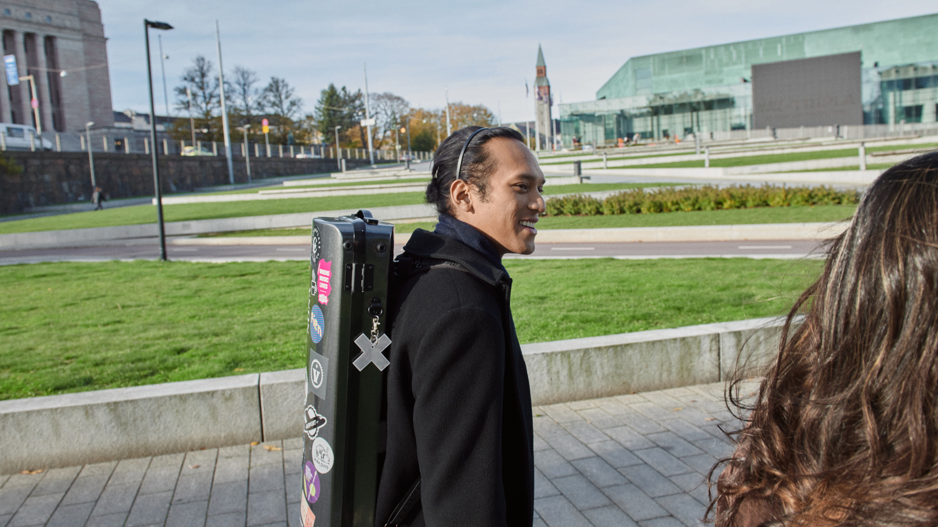 Students walking near Musiikkitalo and Oodi Library