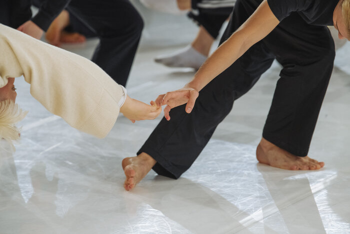 Dancers holding hands