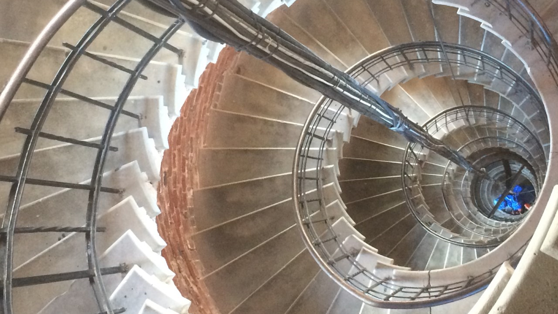 Pedapproach event photo. Image of a spiral staircase taken from above.