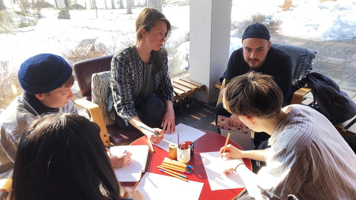 Students in discussion around a table