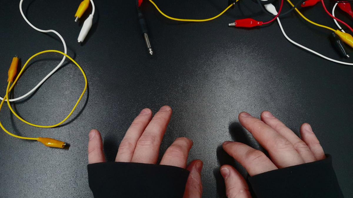 Hands and electrical cords