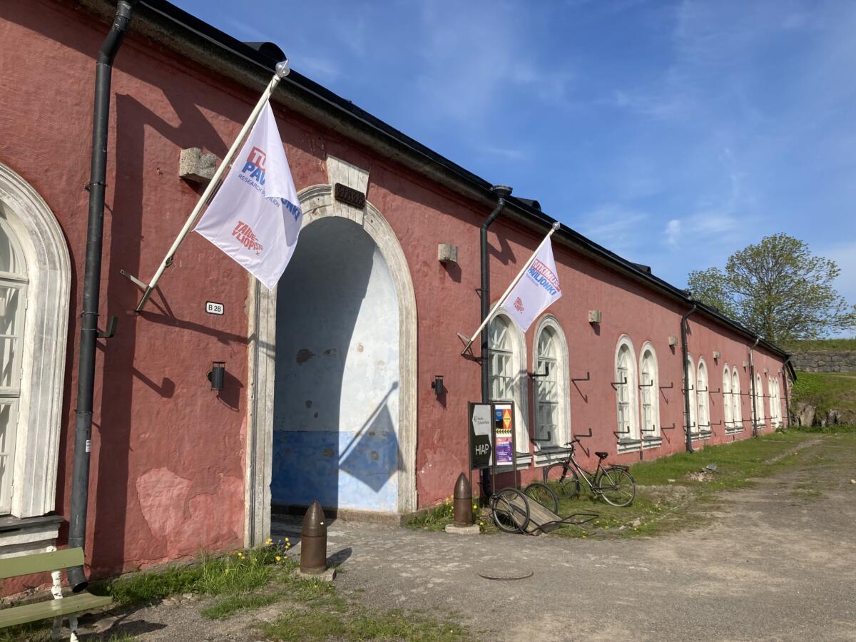 Research Pavilion flags on the Helsinki International Artist Programme building in Suomenlinna.