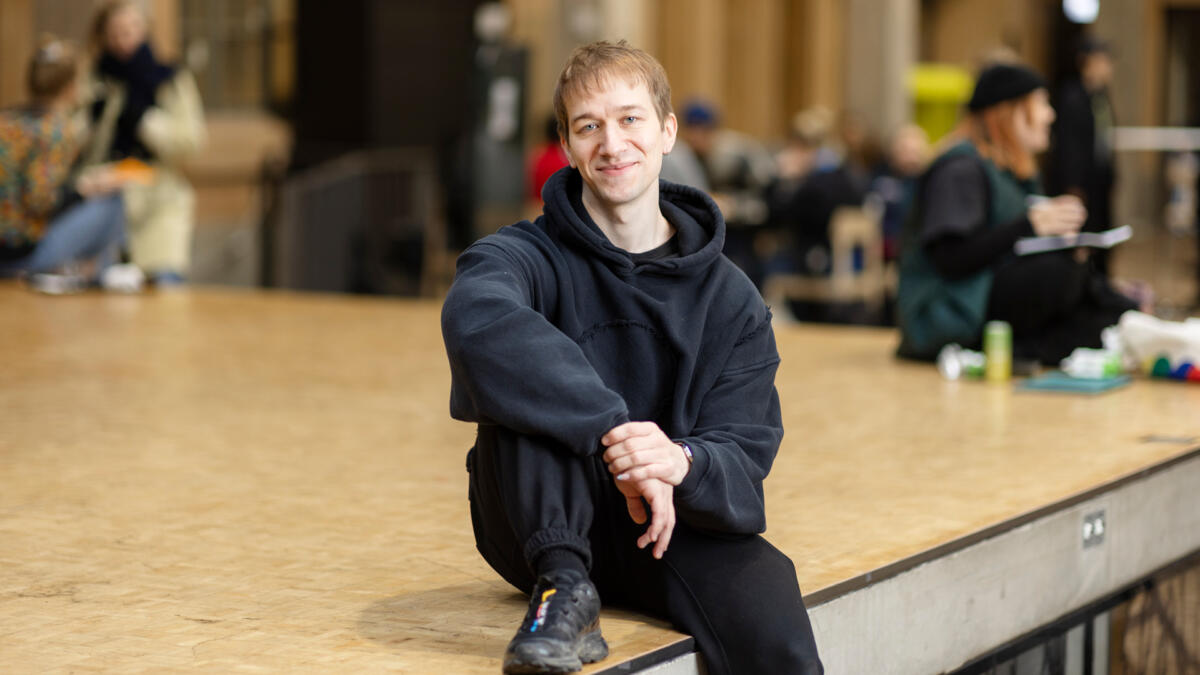 Myrsky sits on stage at the Tori of the Theatre Academy