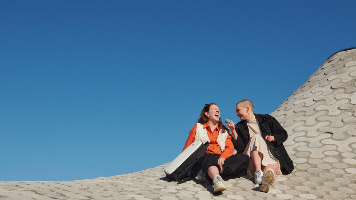 Students sitting on the roof of Amos Rex gallery