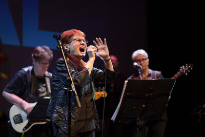 An image of the rock band Riskiryhmä by over 70's women performing.