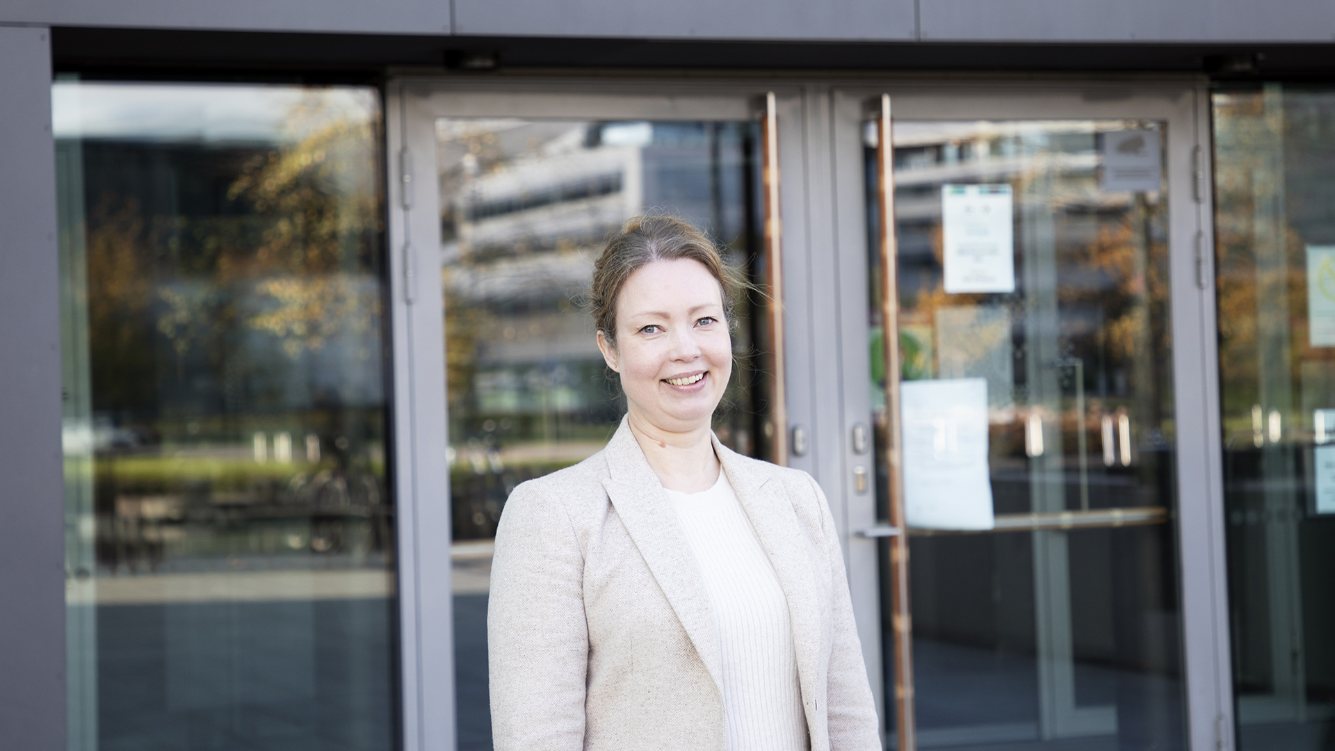 Tanja Johansson stands outside of the Sibelius Academy's main entrance at Helsinki Music Centre